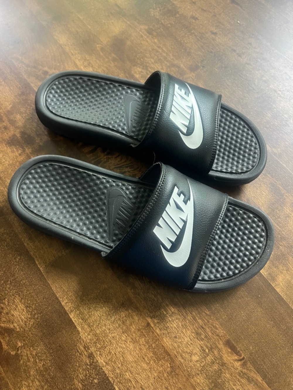 Nike Black Slides with White Swoosh Logo